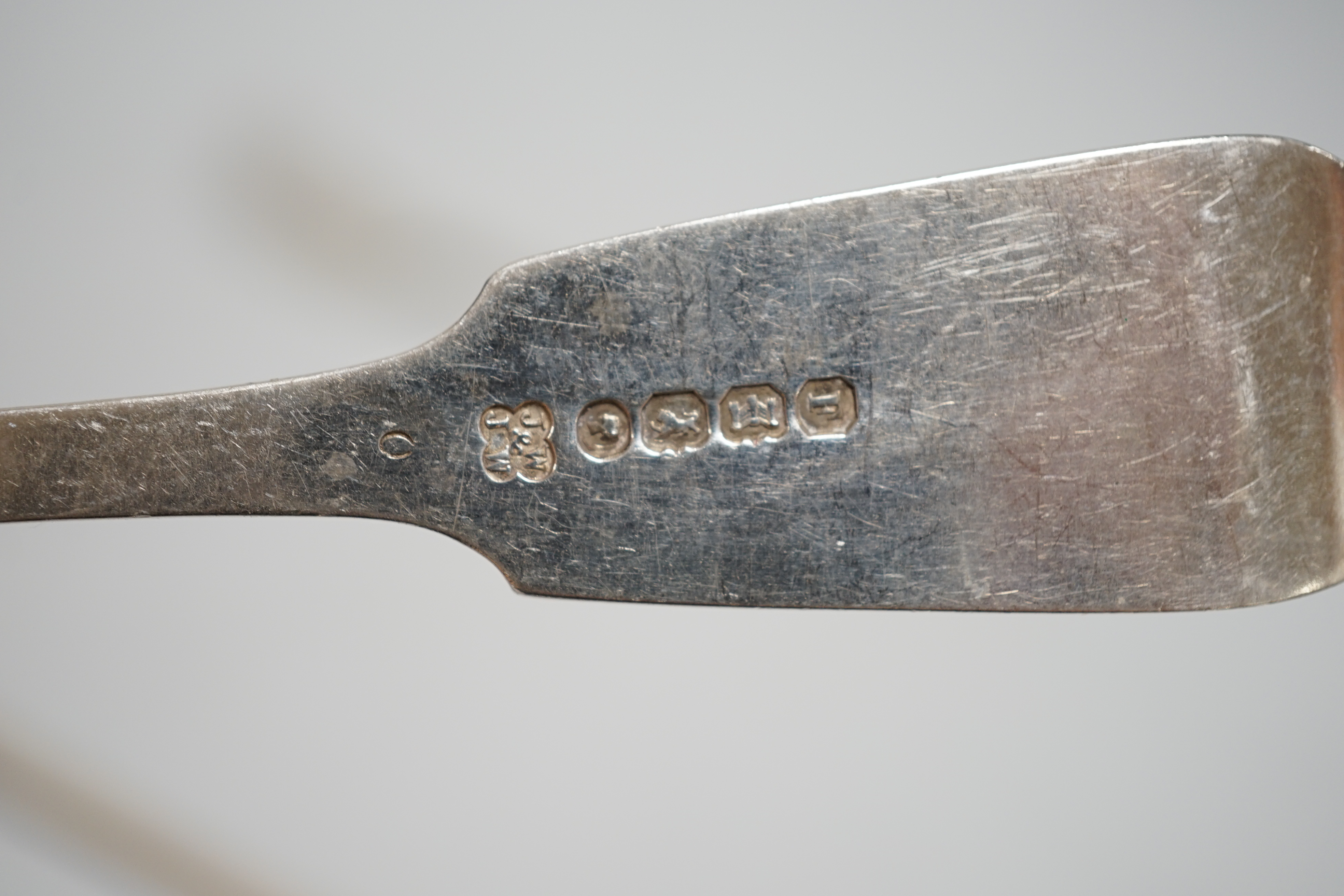 A Victorian silver fiddle pattern basting spoons, Charles Wallis, London, 1852, 30.4cm and a pair of Victorian provincial silver dessert forks, Josiah Williams & Co, Exeter, 1862, 7.6oz.
